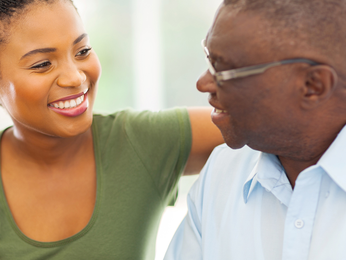 A image of loved ones enjoying coffee at an assisted living facility.